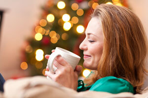 woman drinking hot chocolate at Christmas